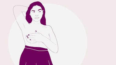 Woman doing self-breast check