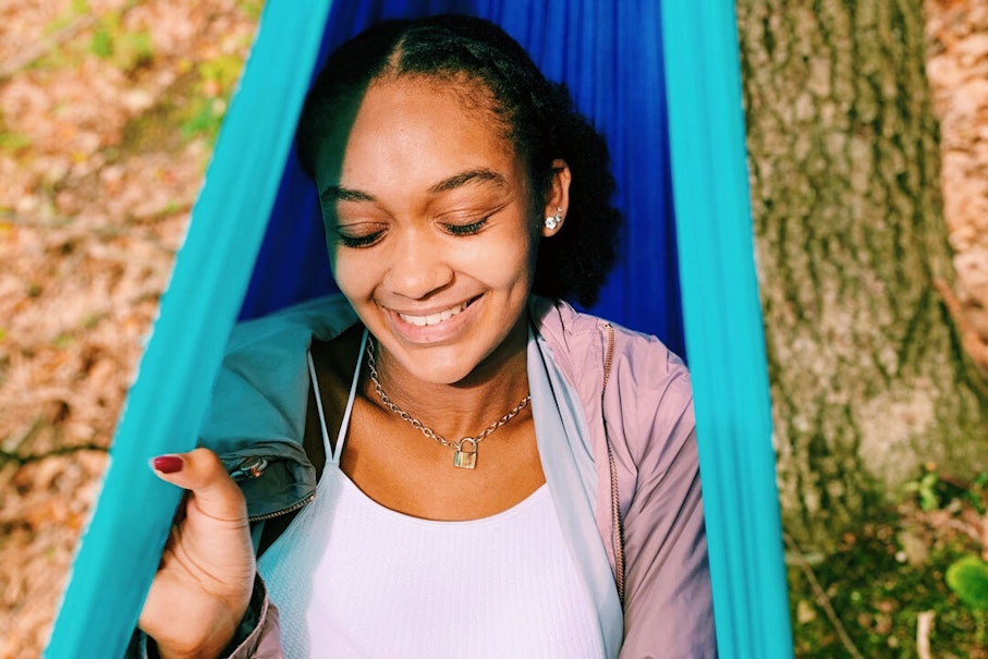 Sophia smiling in a hammock