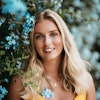 Headshot of Alice Rose with flowers
