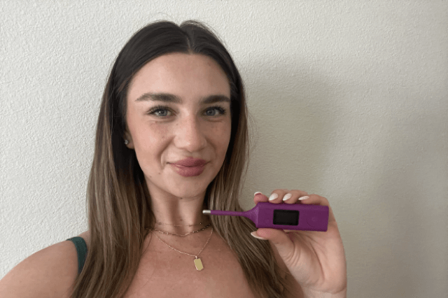 Sophia holding new Bluetooth thermometer