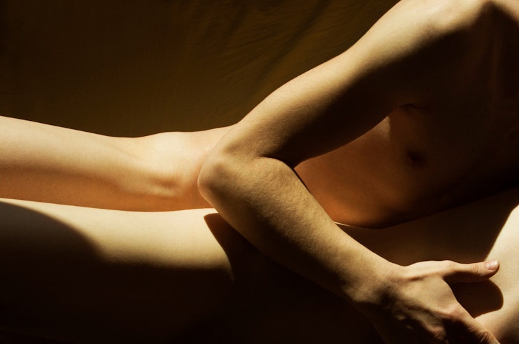 Photo of two bare bodies pressed together