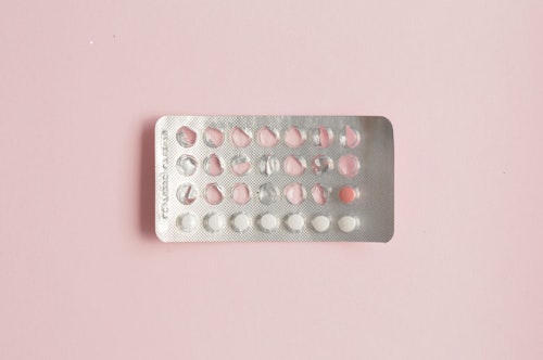 Photograph of a packet of birth control pills with only a few pills left in the packet