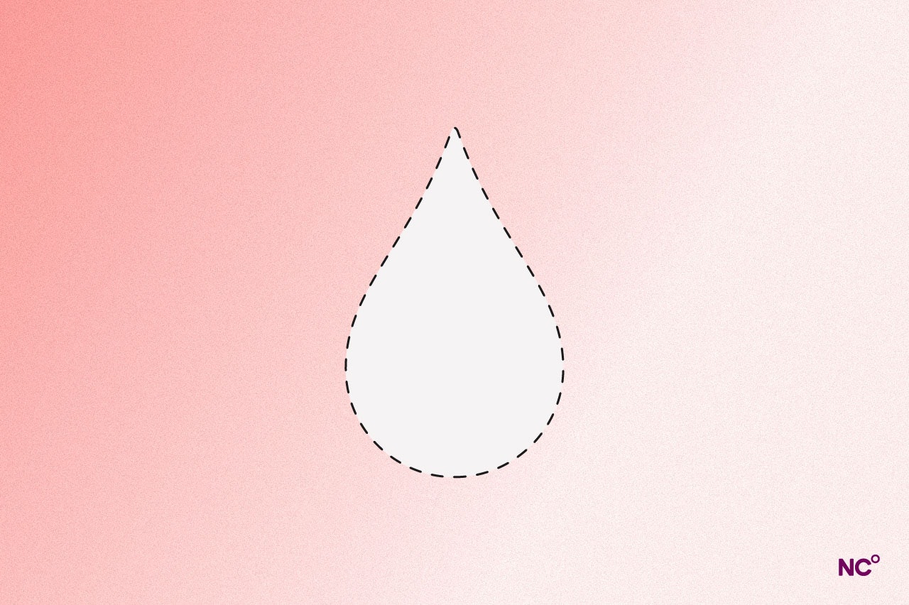 Droplet of moisture on a peach-colored background