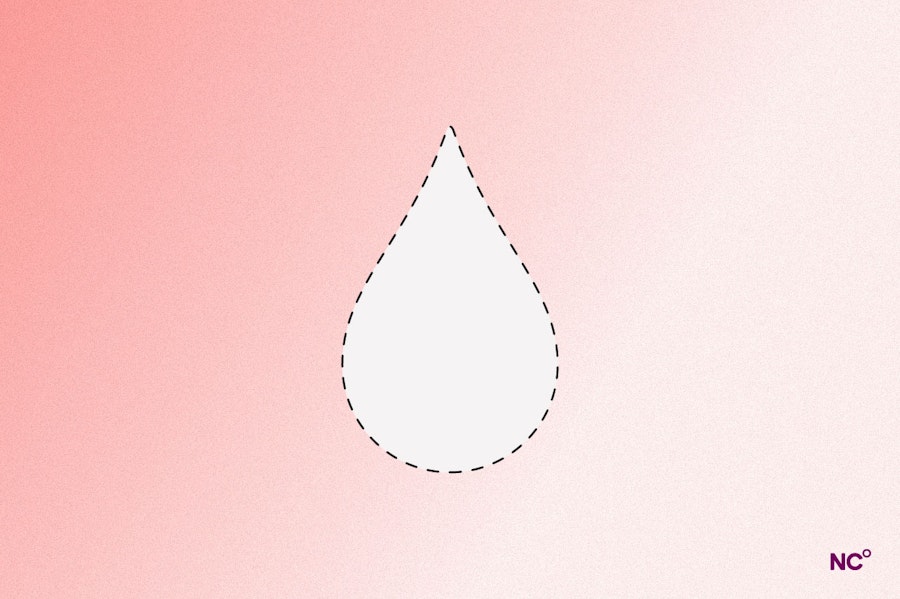 Droplet of moisture on a peach-colored background