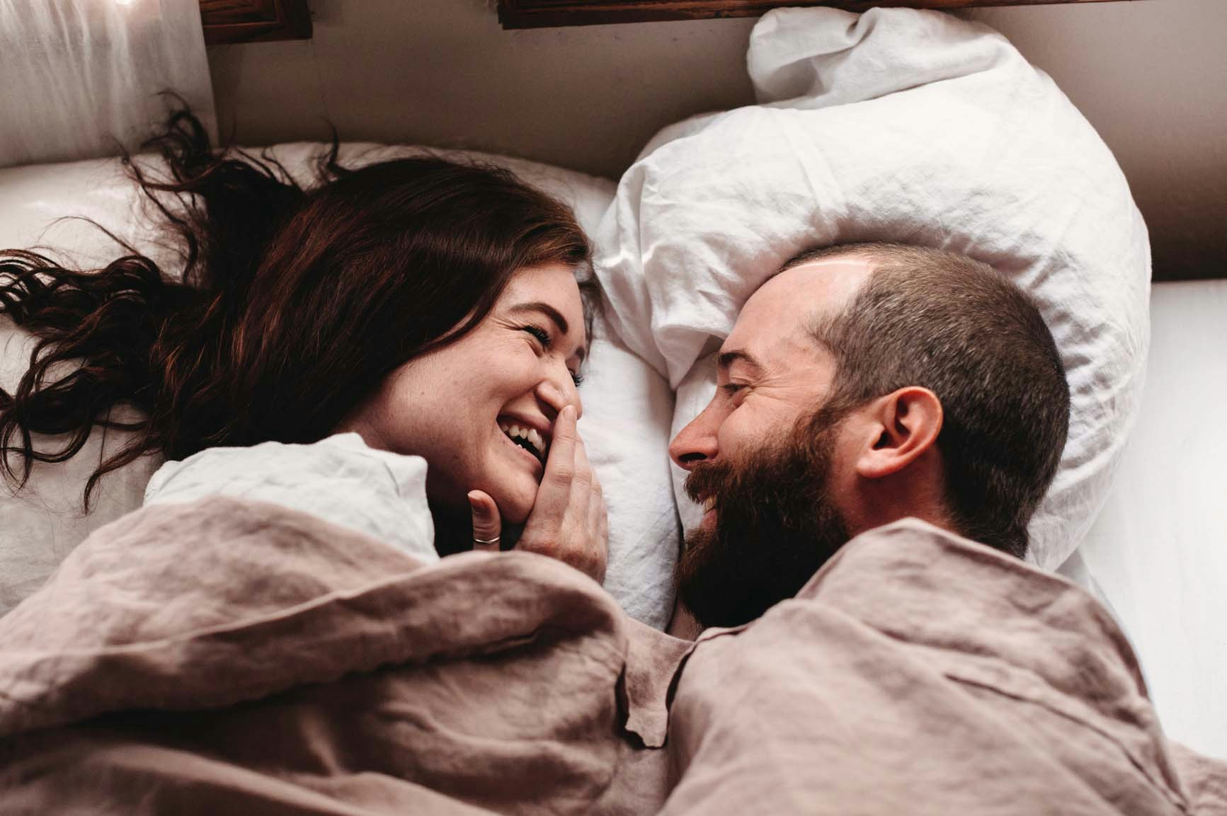 Couple in bed cuddling