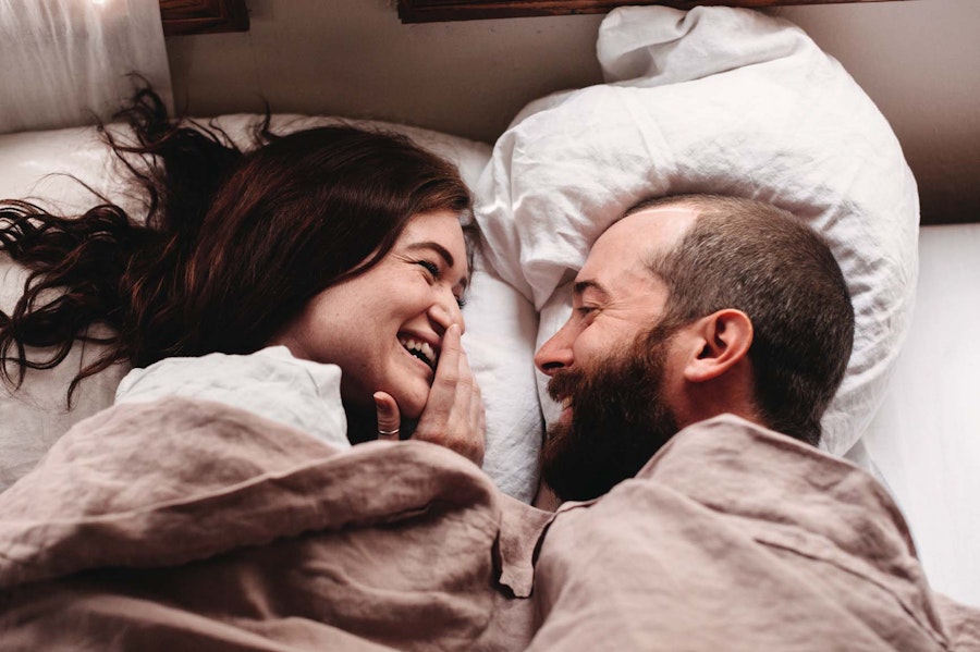 Couple in bed cuddling