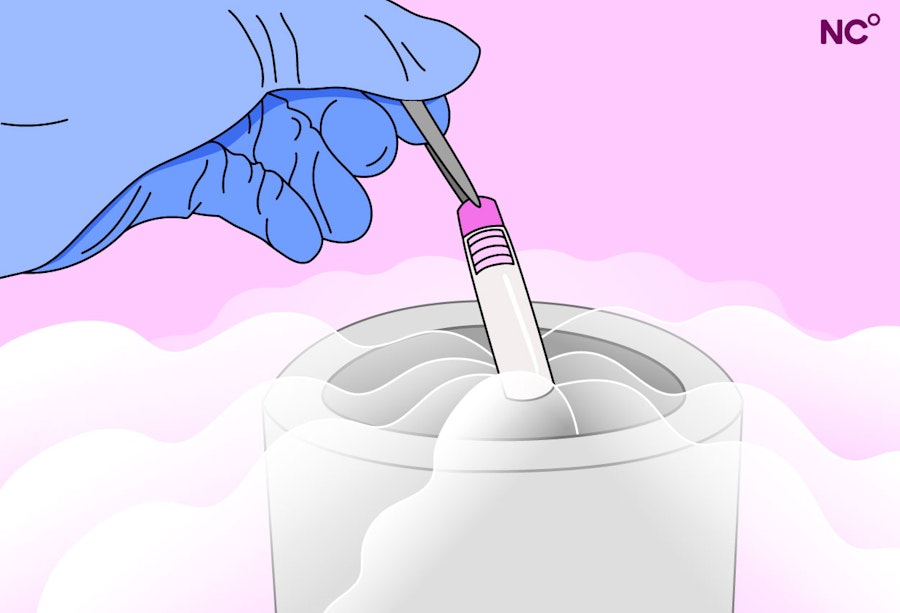 Illustration of a gloved hand holding a test tube with tweezers and lowering it into a liquid nitrogen tank