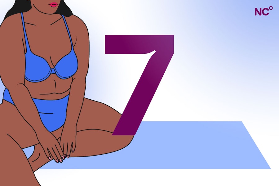 Picture of a woman 7 weeks pregnant on a yoga mat