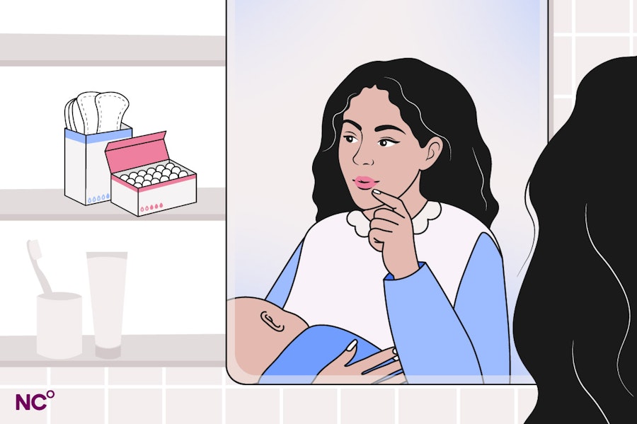 Woman looking thoughtful while looking in bathroom mirror holding a newborn baby, she is looking at the inside of the bathroom cabinet where tampons and pads are visible