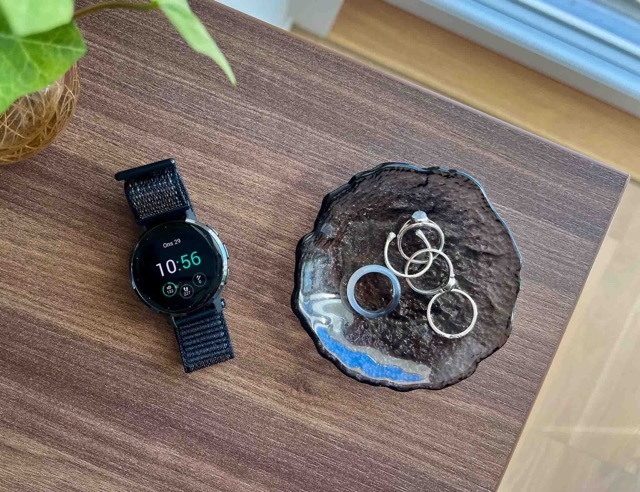 Garmin smartwatch on the nightstand with rings