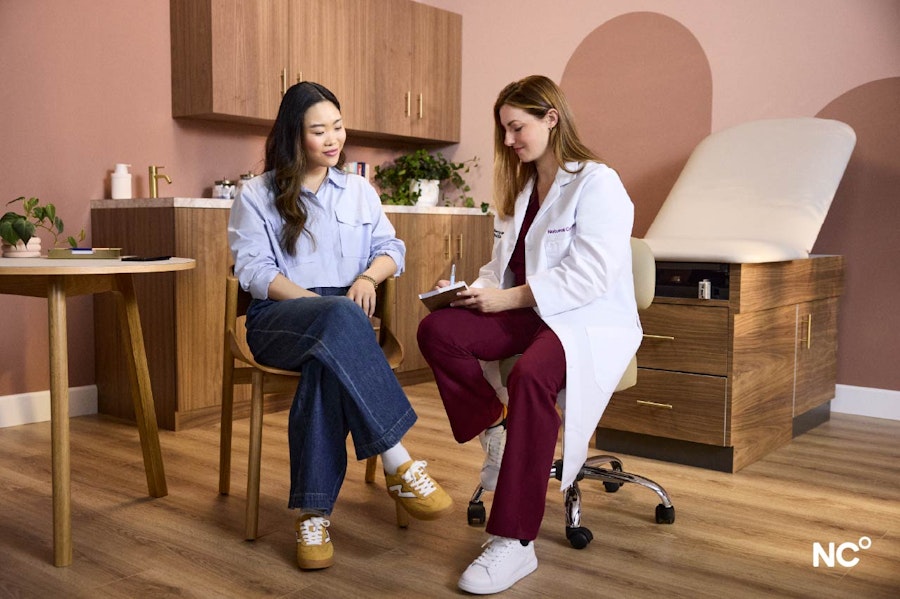 Dr Kerry Krauss talking to a patient in the doctor's office
