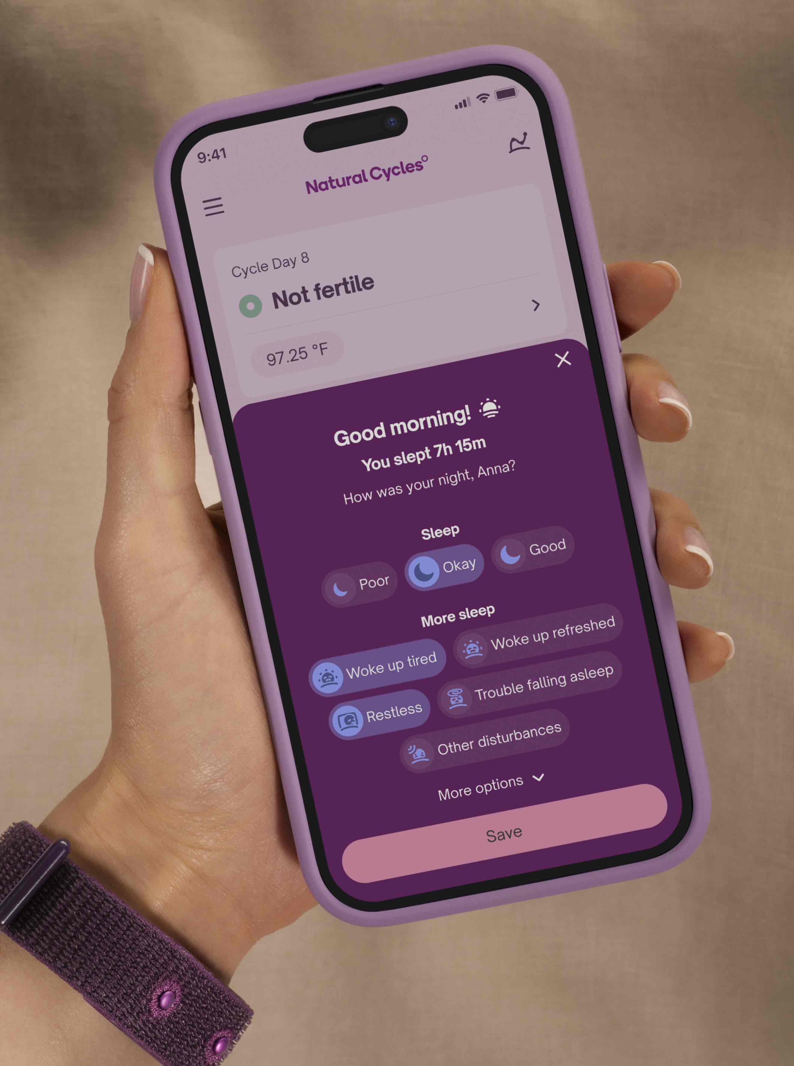 Hand holding a phone showing the Sleep Insights screen in the Natural Cycles app