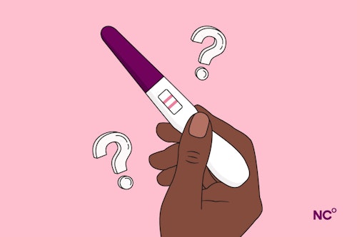 Illustration of a hand holding a pregnancy test