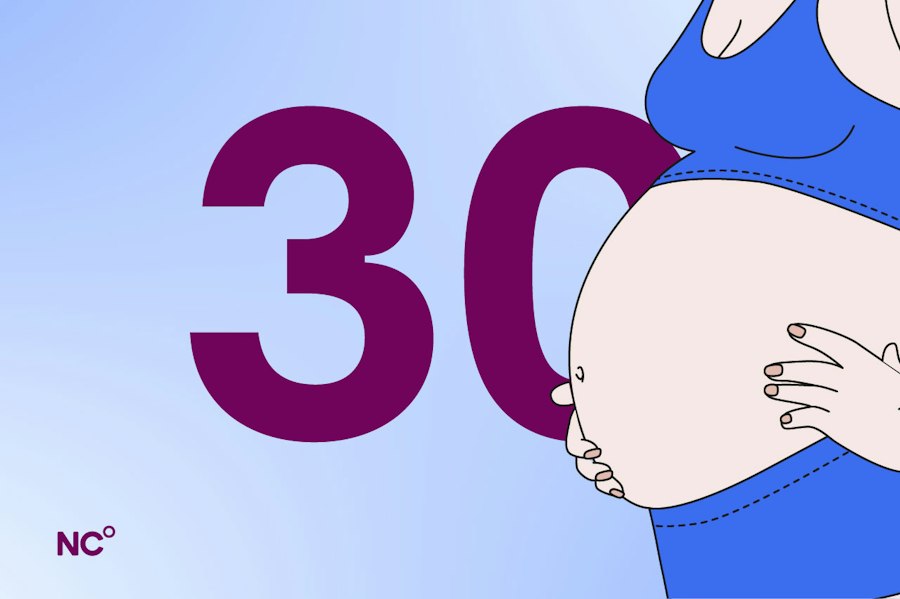 Pregnant woman holding her bump next to the number 30