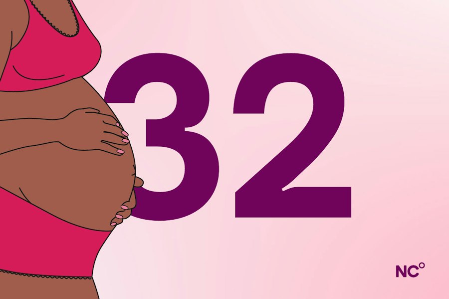 Pregnant woman in her underwear holding her bump next to the number 32