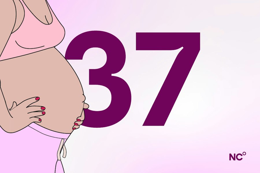 Pregnant woman wearing a bra and sweat pants holding her bump next to the number 37