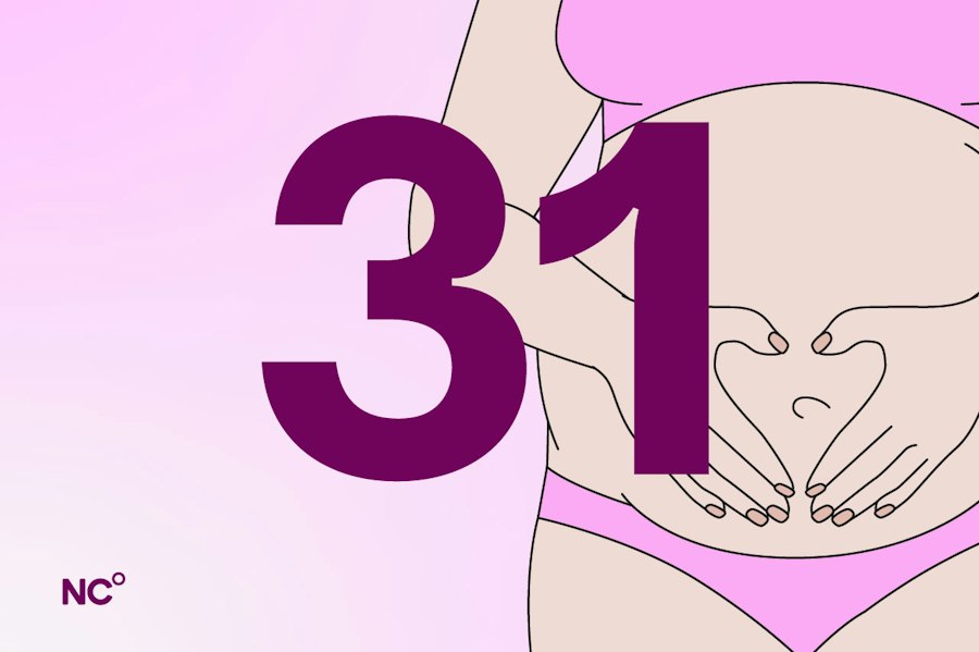 Pregnant woman holding her belly next to the number 31
