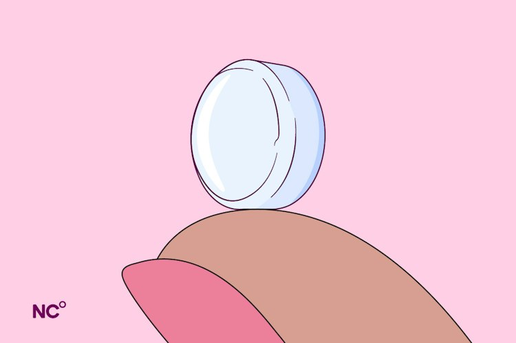 Illustration of a pill balancing on the tip of a woman's finger
