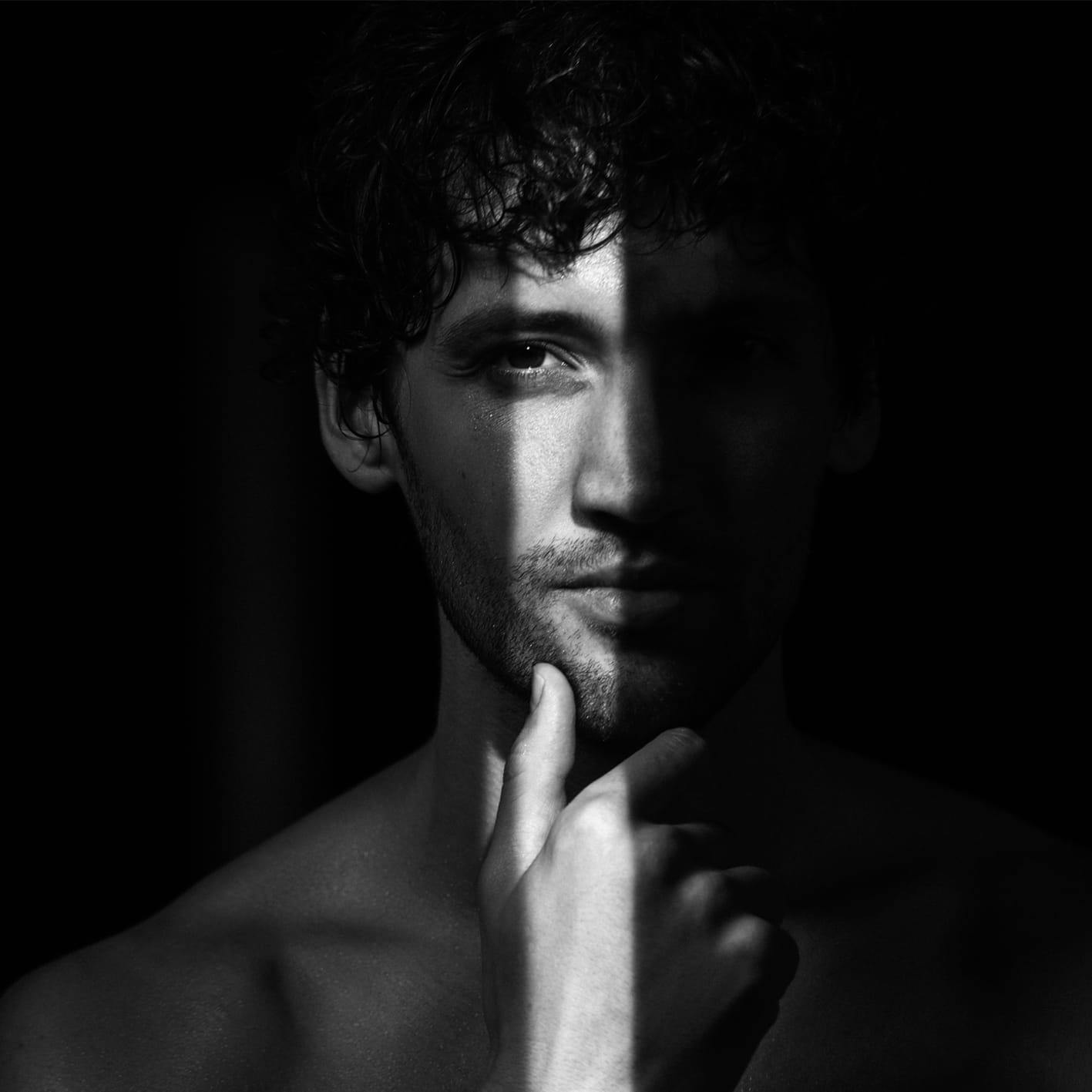 man touching his chin