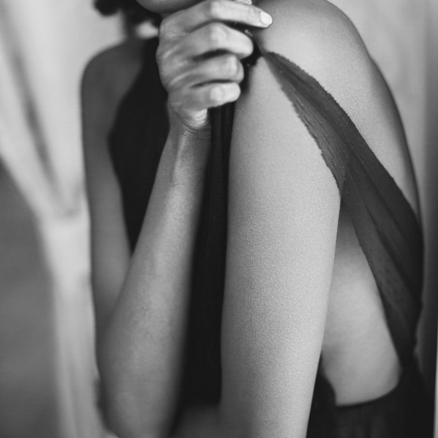 woman pulling her dress strap up