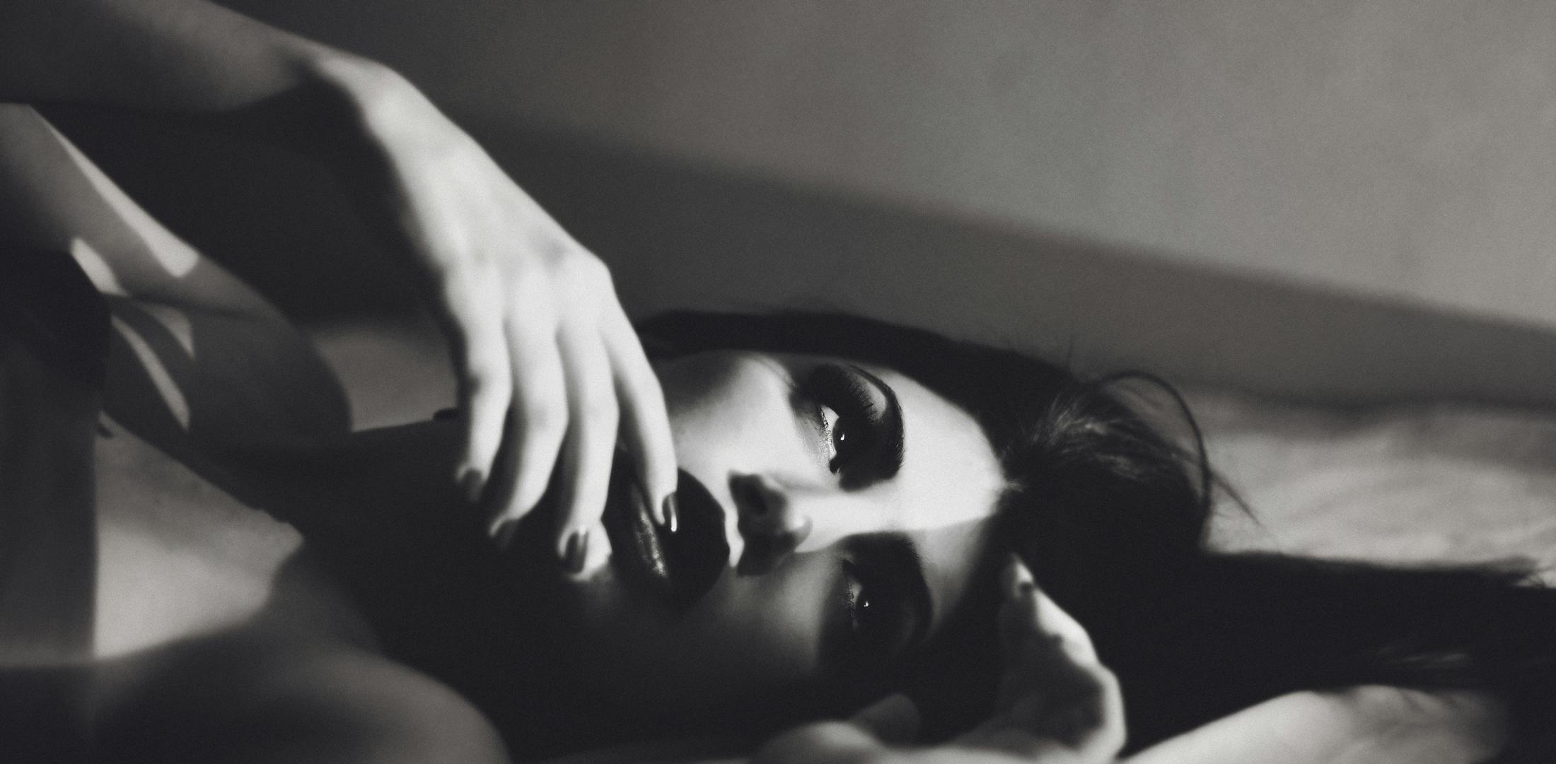 woman touching her lips