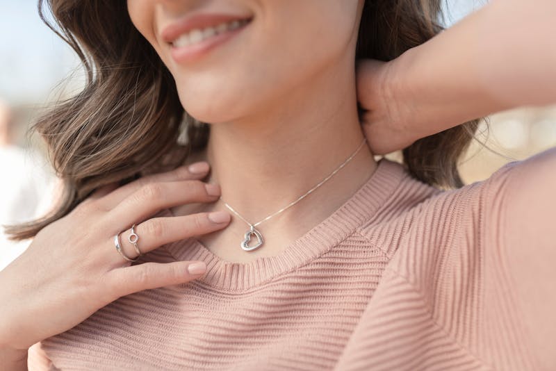 woman touching necklace