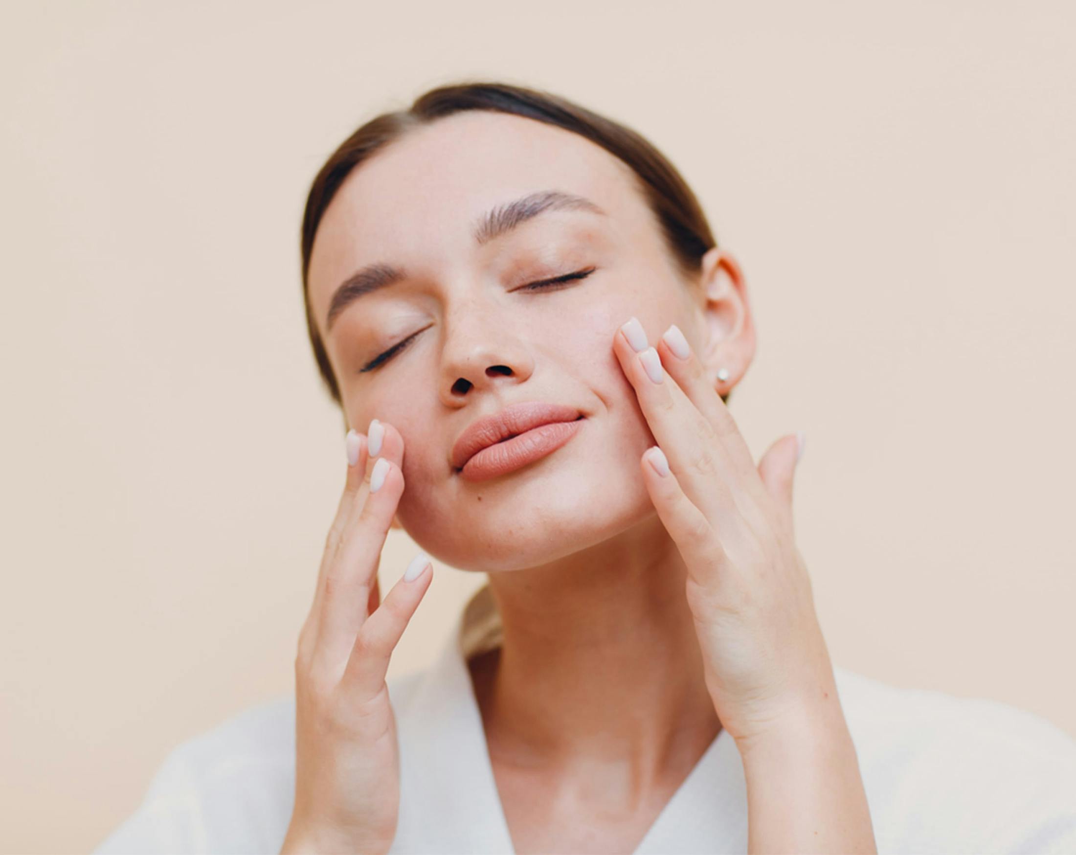 woman touching her face