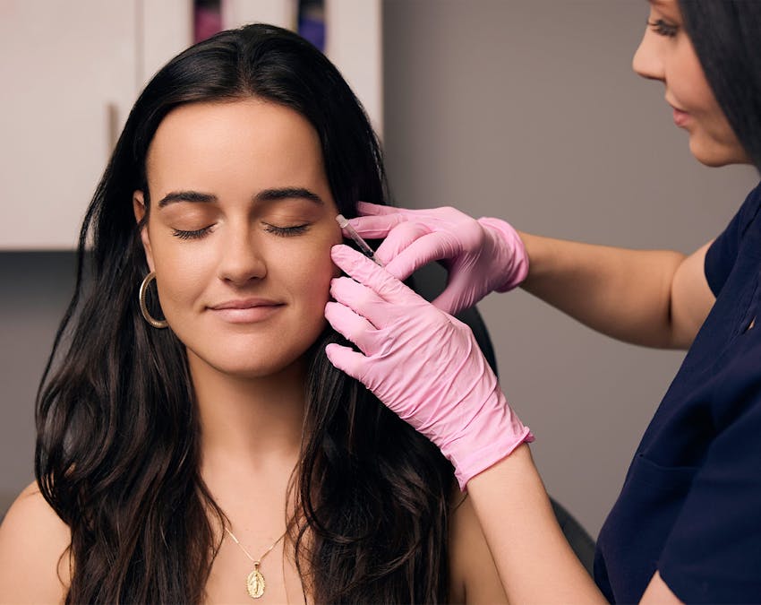 woman getting an injectable treatment