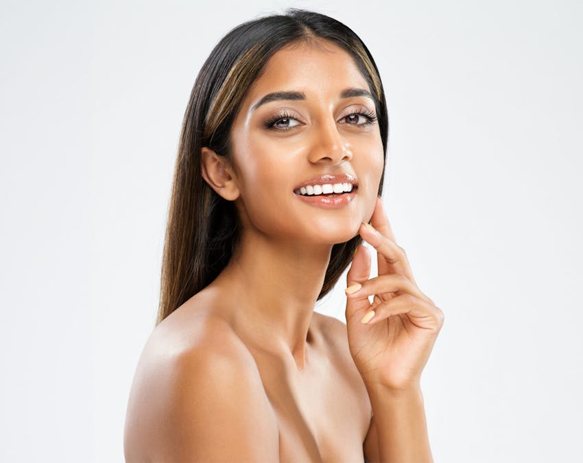 woman touching her jaw