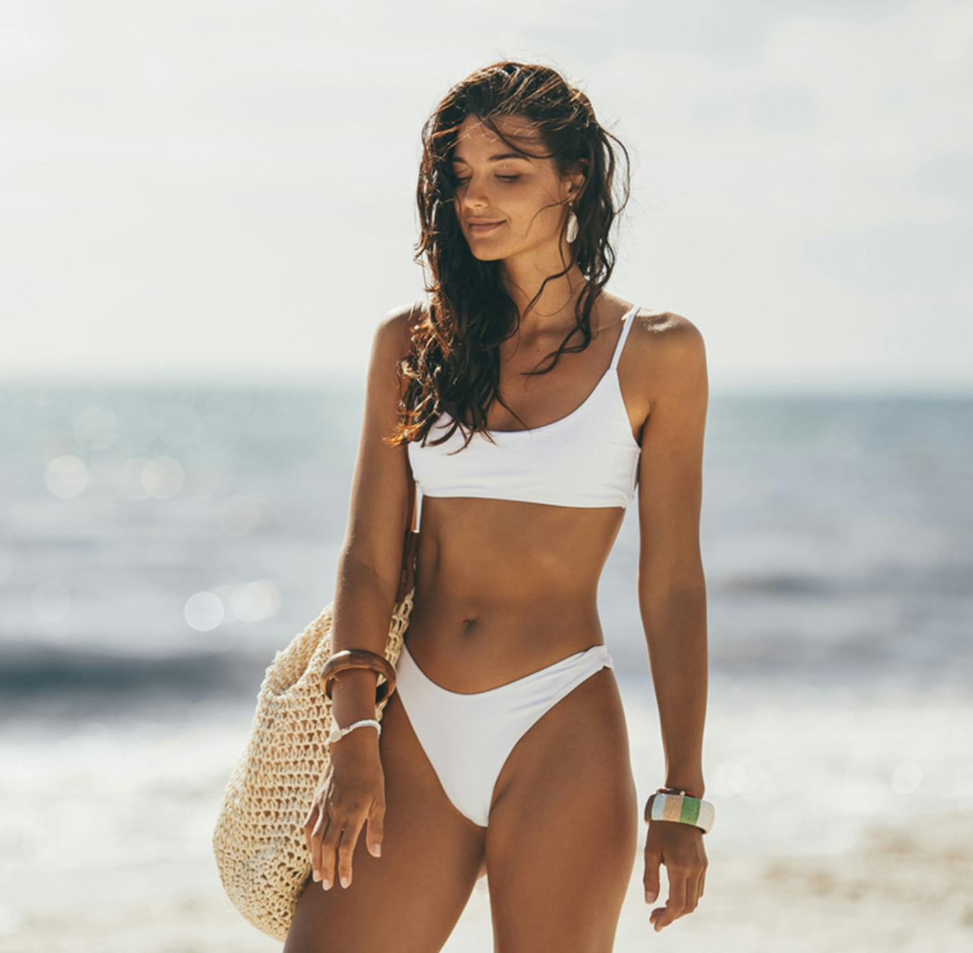 woman in a white bikini at the beach