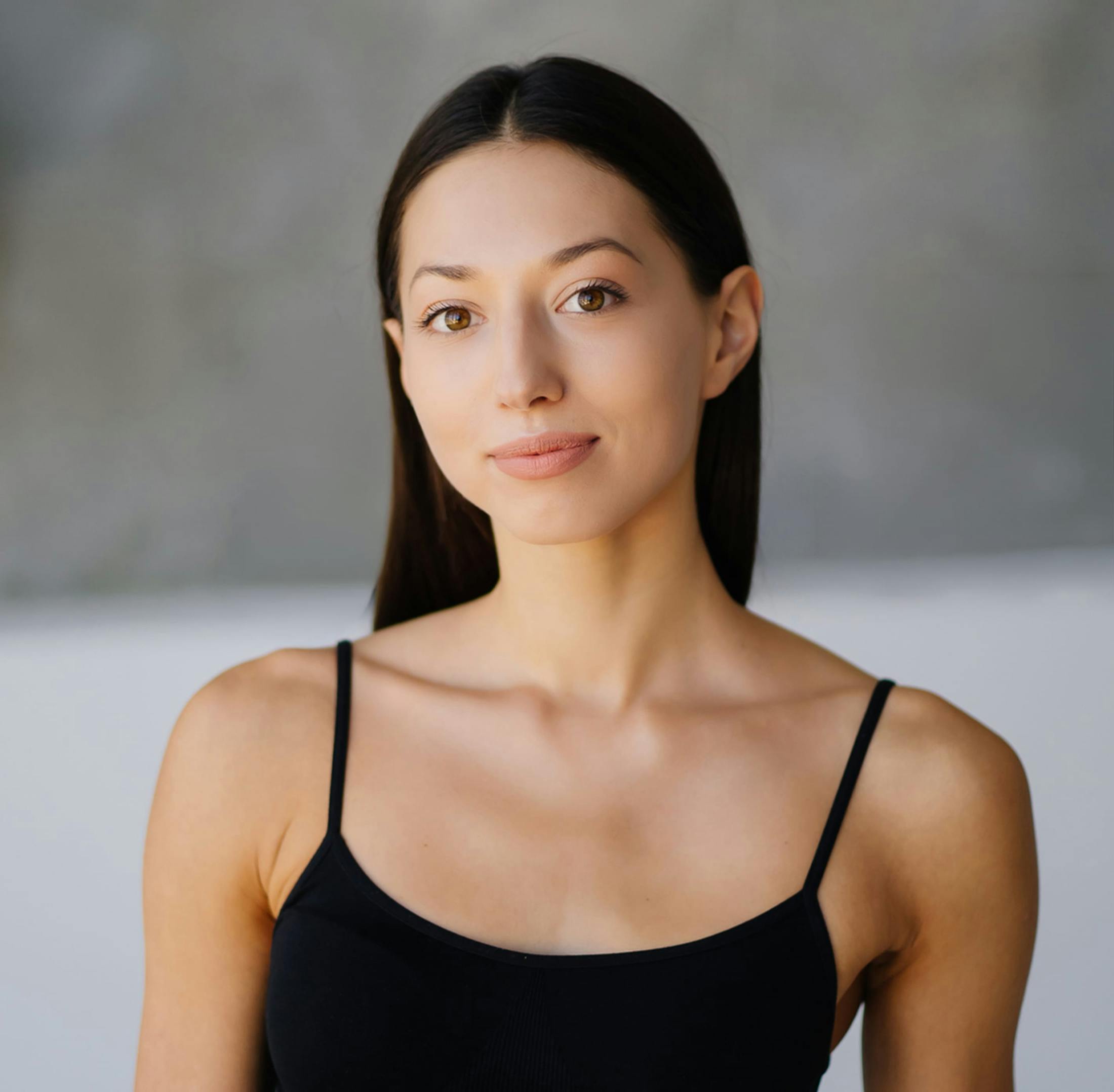 smiling woman touching cheek