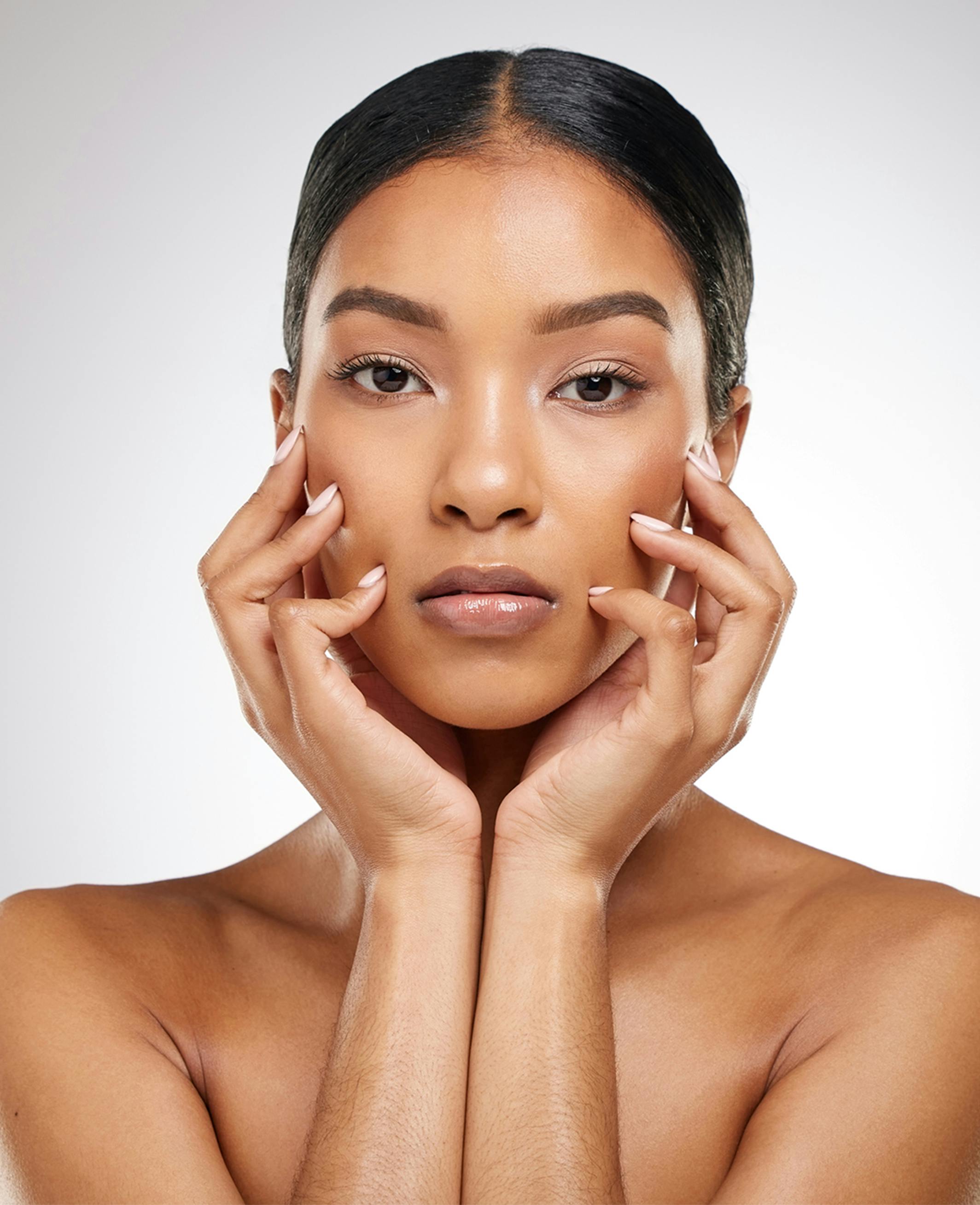 model holding her face