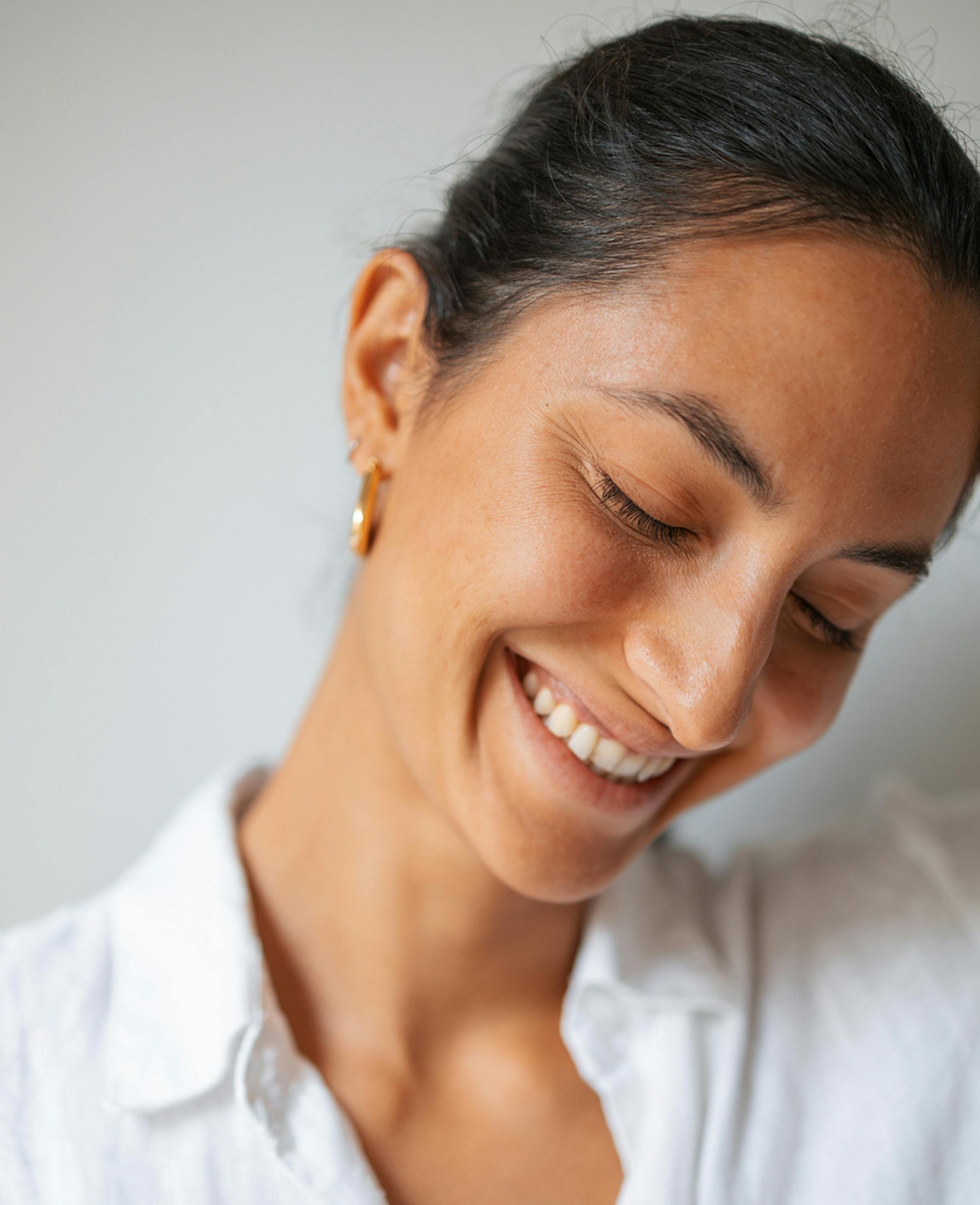 model smiling looking down