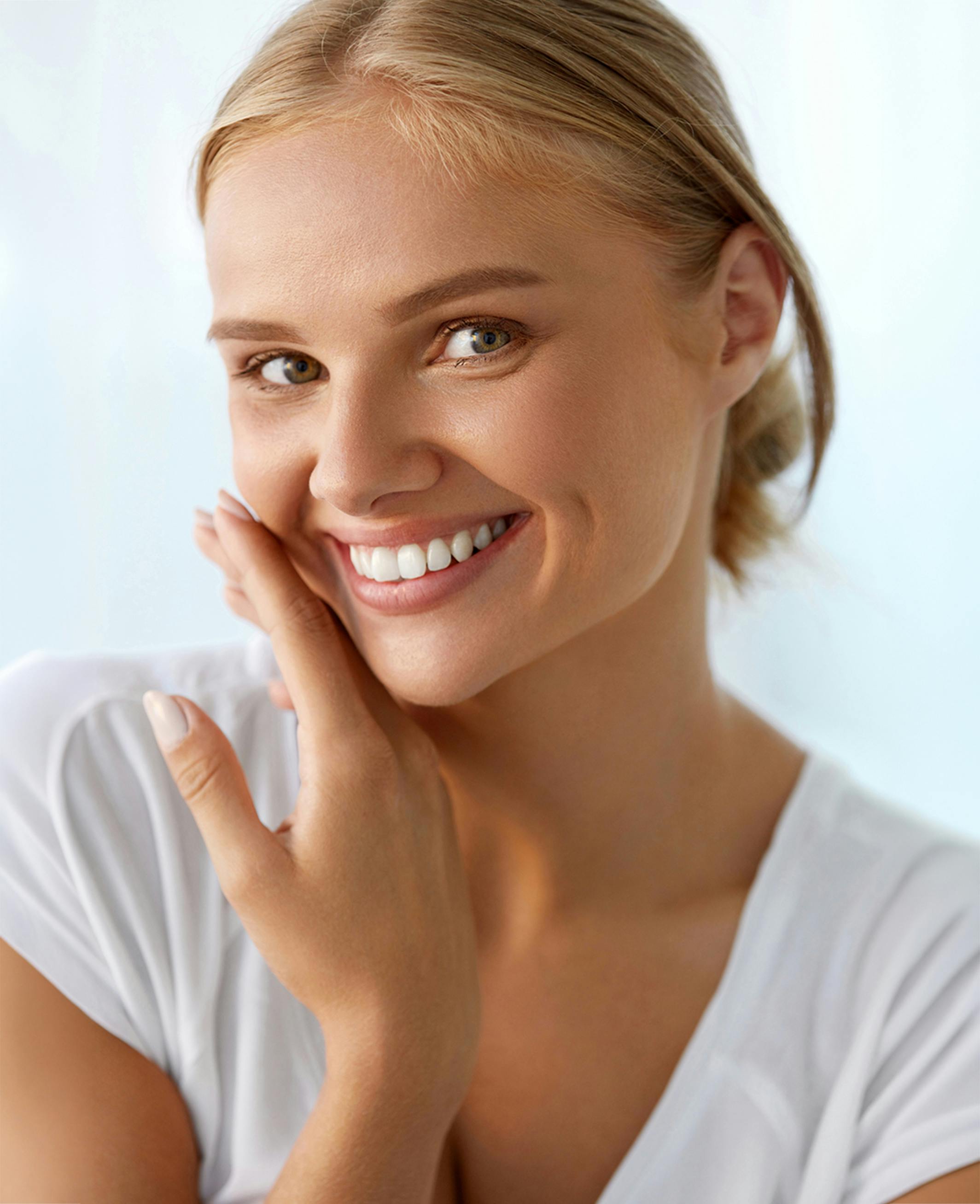 women touching her face