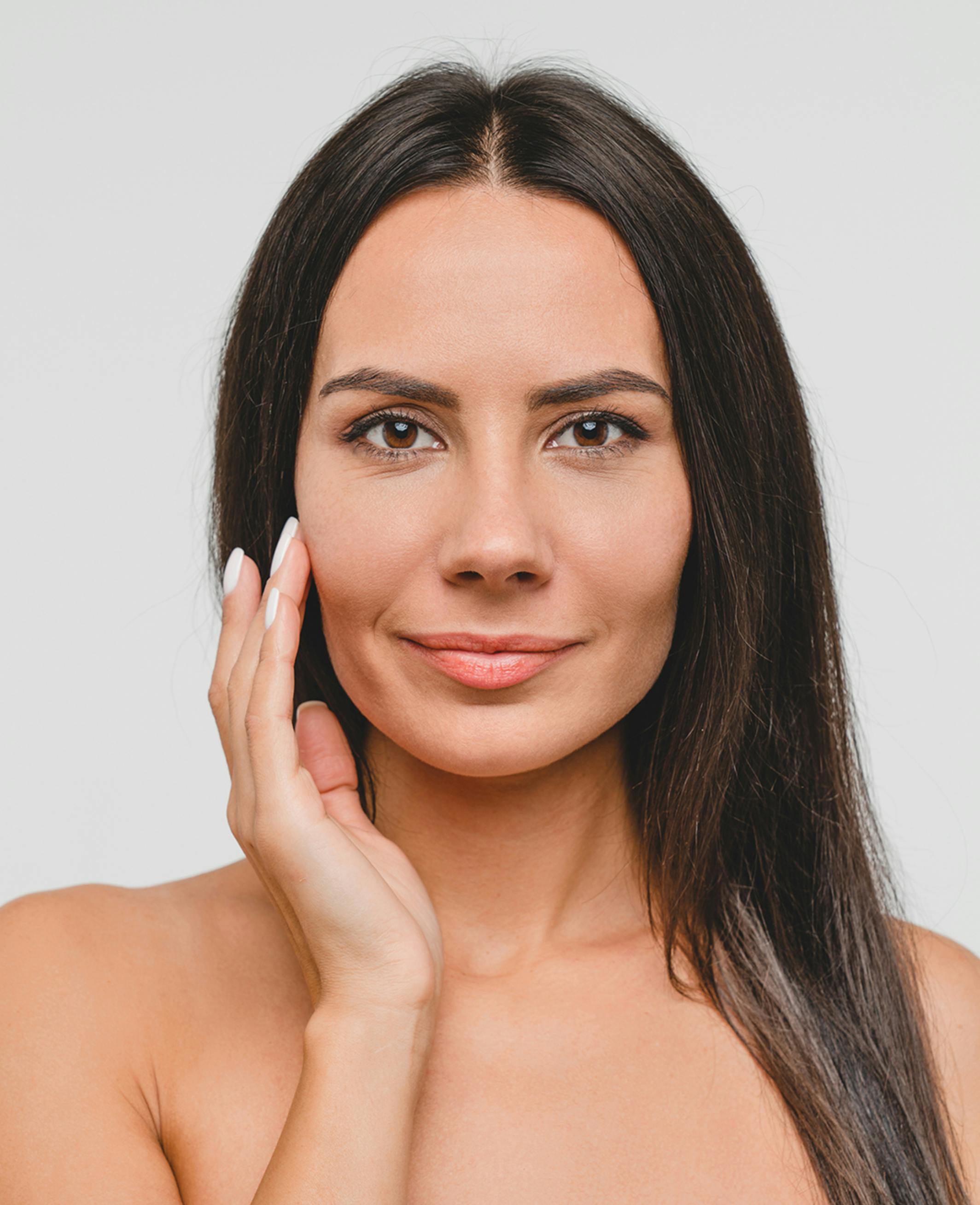 model holding her face