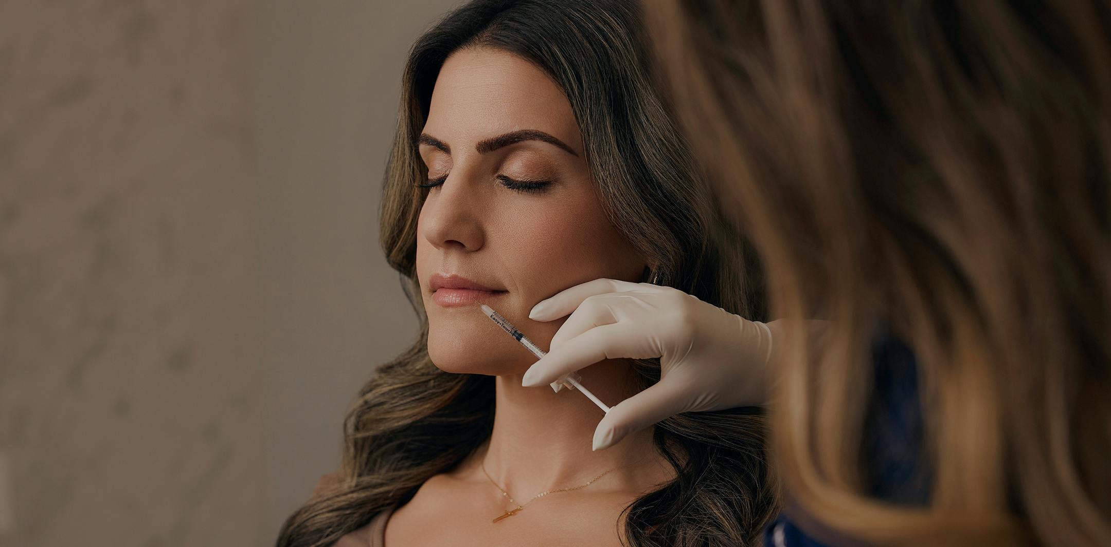 woman getting facial injection