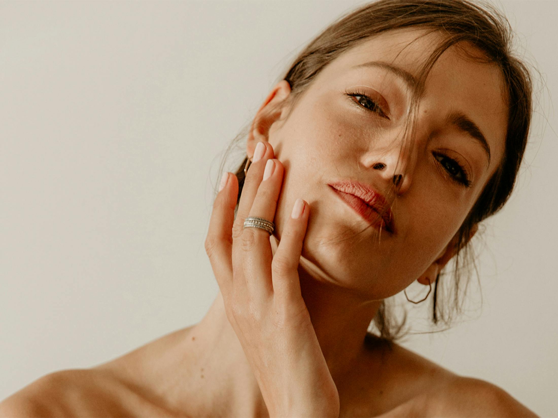 women holding her face