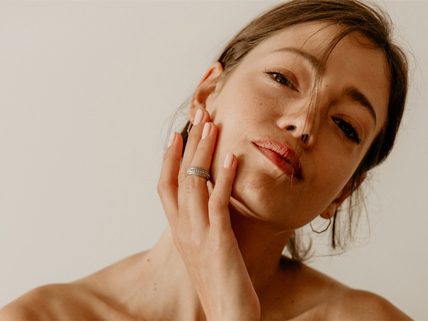 women holding her face