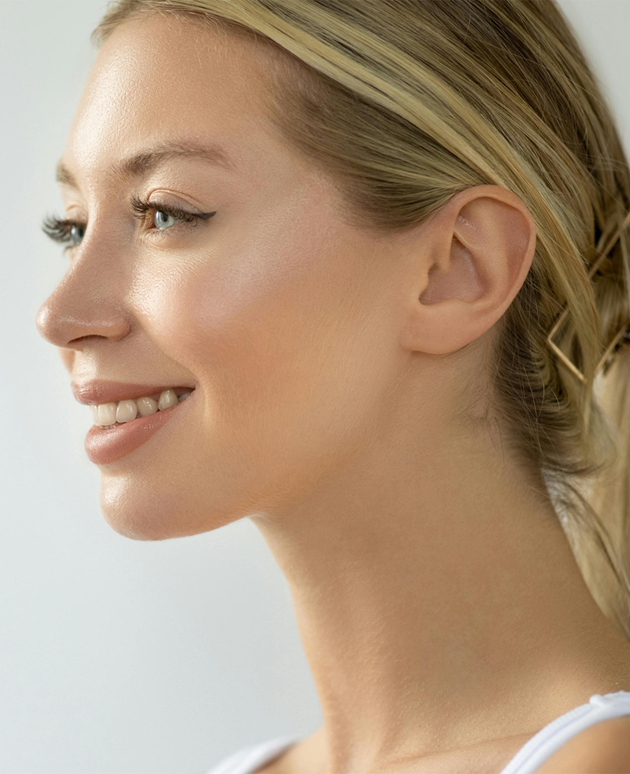 side profile of a model smiling
