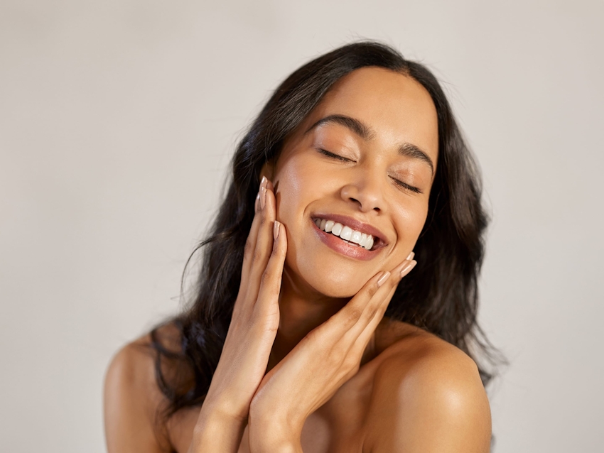 model holding her face