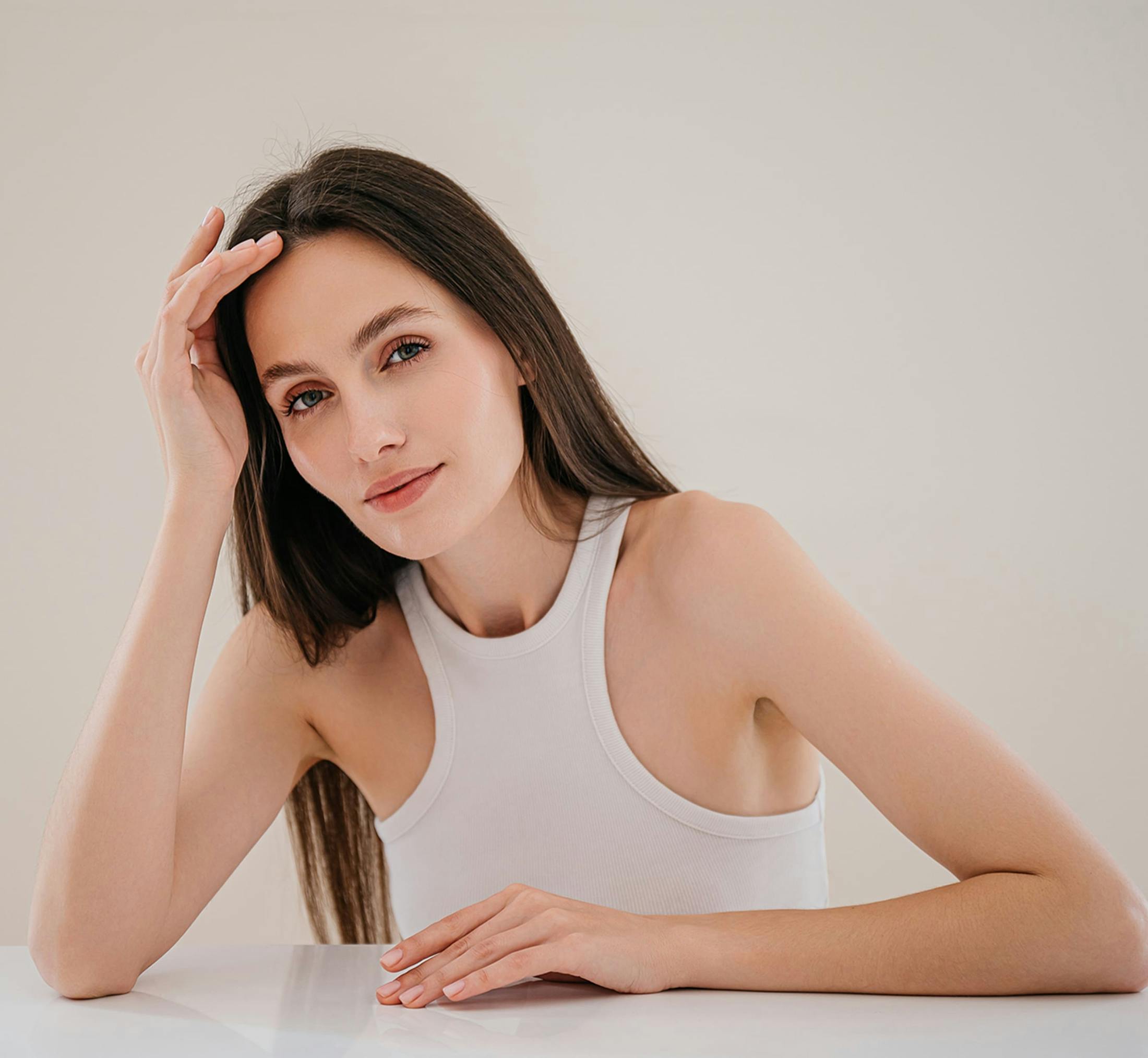 Woman touching her head
