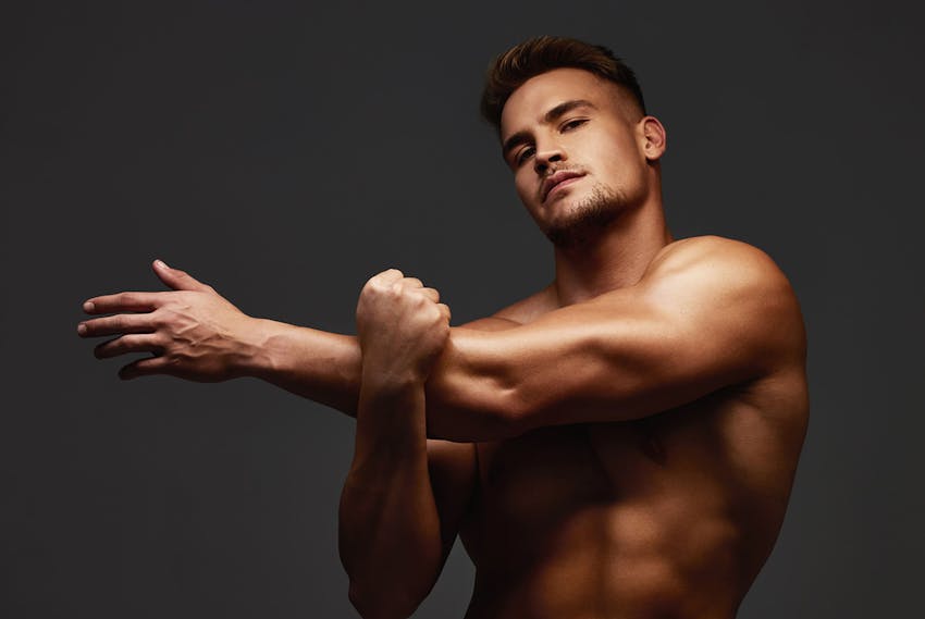Man stretching arms