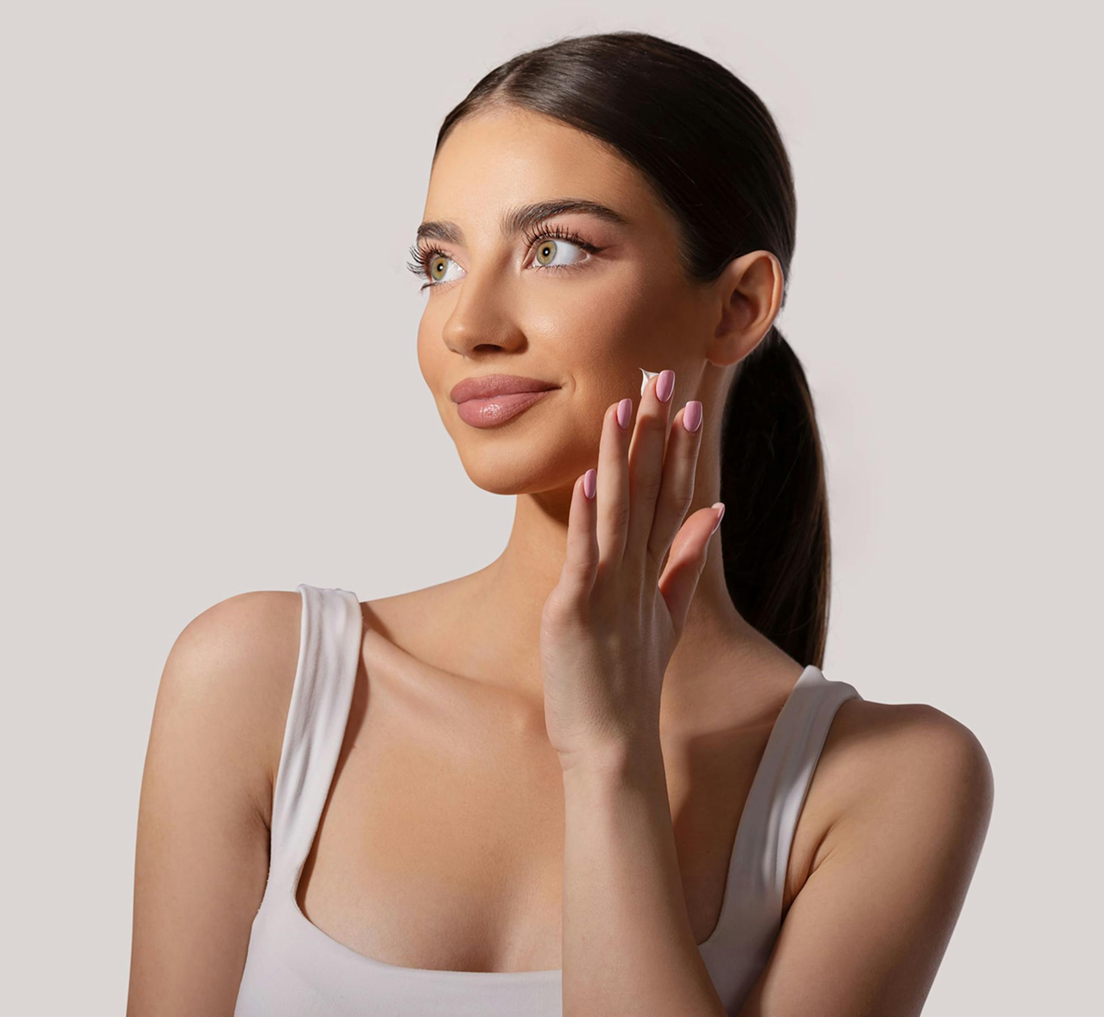 women touching her face