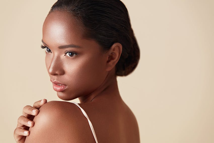 model posing holding her arm
