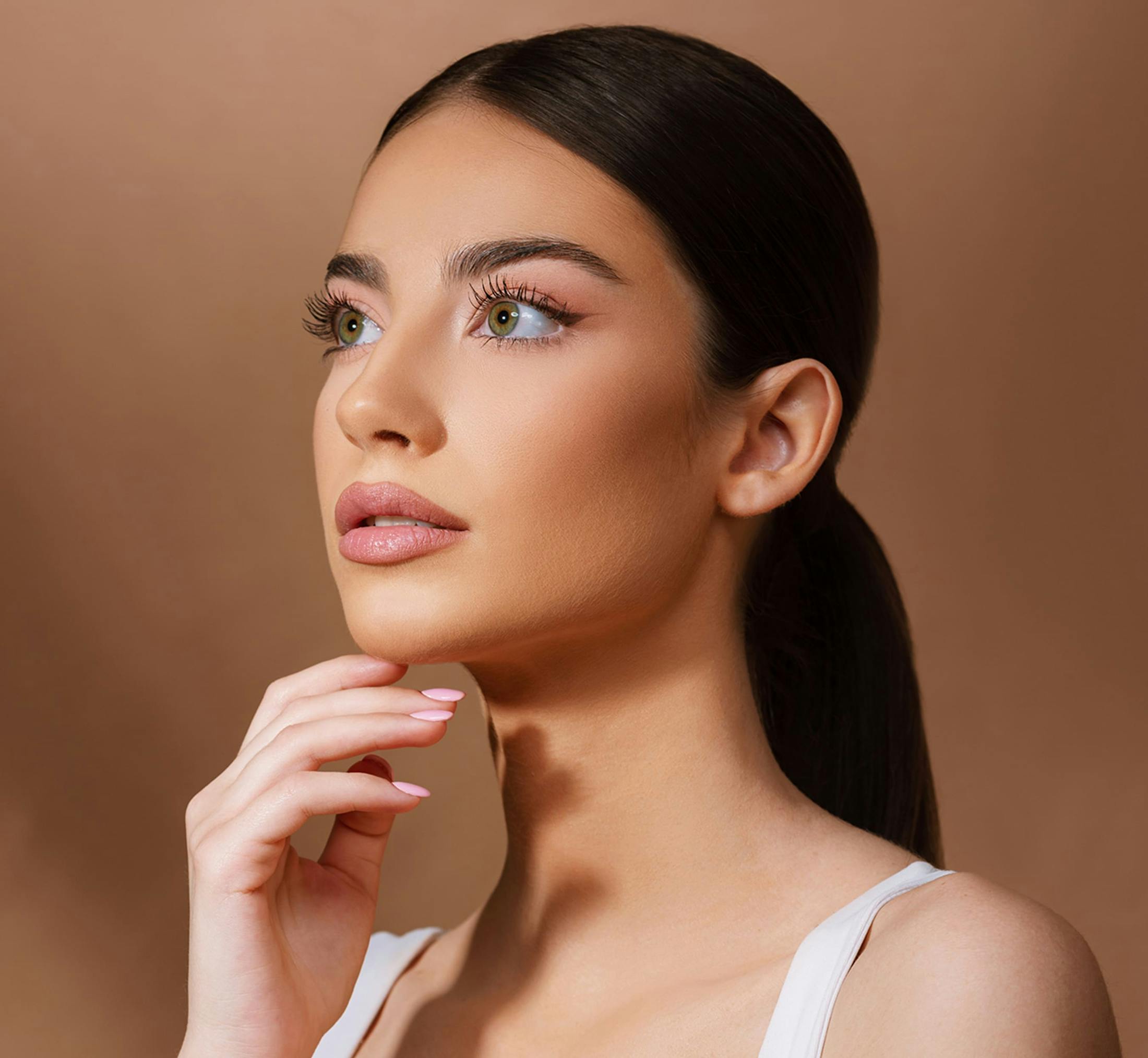 model touching chin