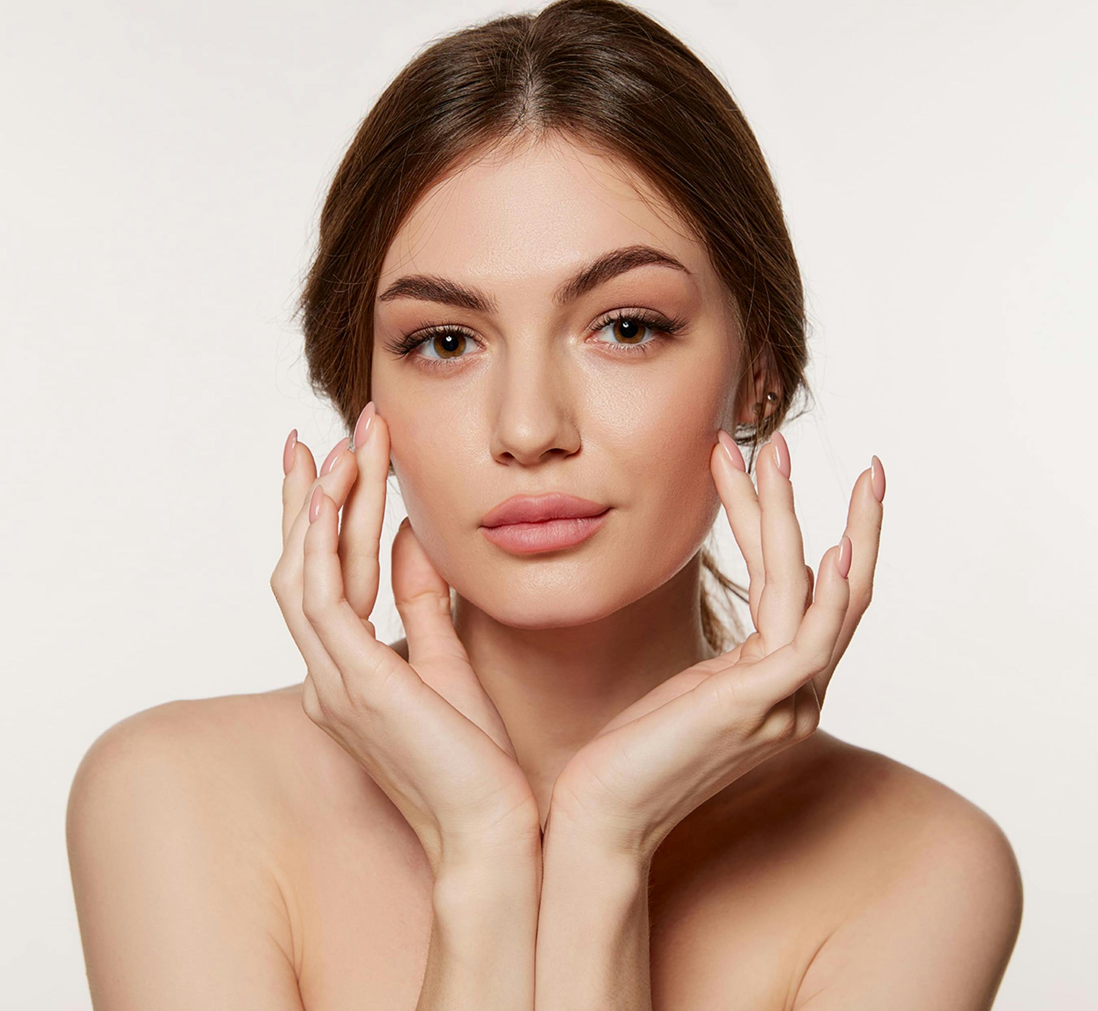 Woman touching her jawline