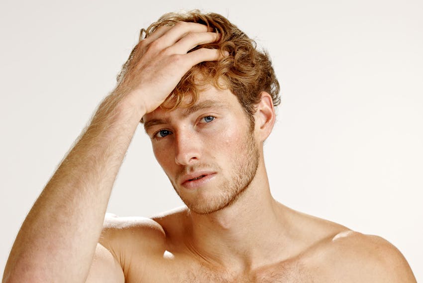 Man touching his hair