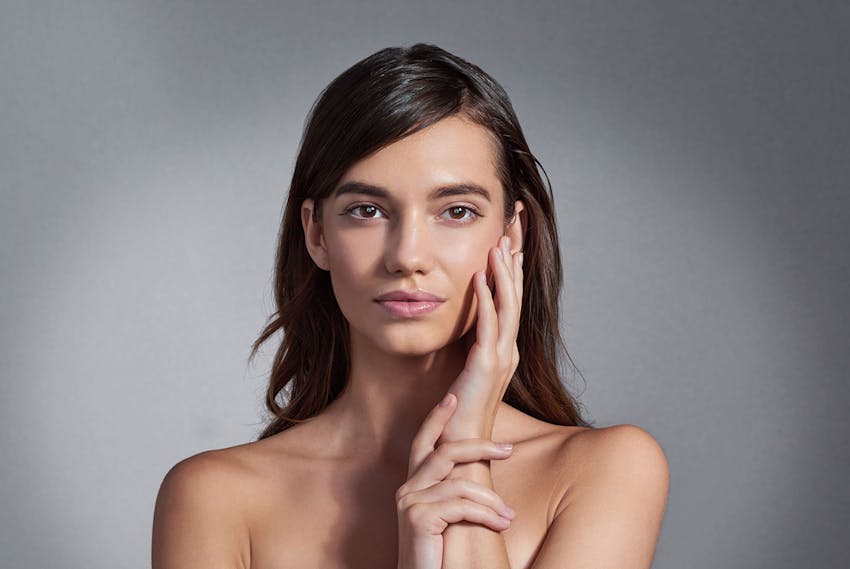 women holding her face