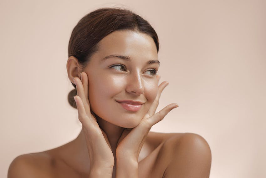 Woman touching her face