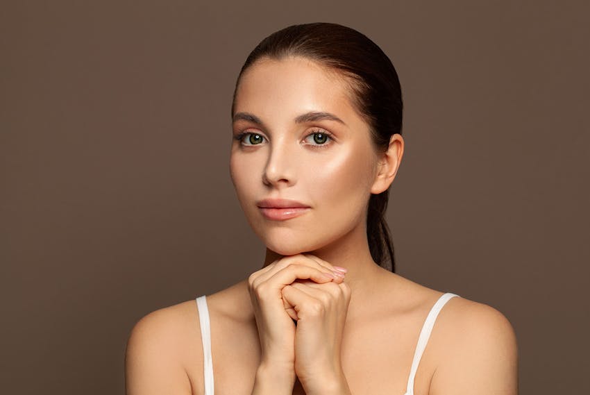 Woman with hands clenched